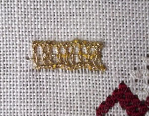 Interlaced Ladder Stitch In gold Thread on the Spot Sampler