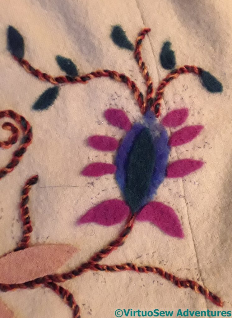 A very ornate motif in felt