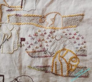 A portion of the embroidered depiction of an excavation in browns and golds, using different intricate line stitches to help differentiate the different figures. The background is being filled with a stitch that resembles a sprouting plant, using a variegated greeny gold thread.