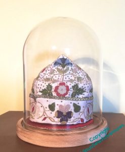 Parlour Dome with a wooden base, containing the small Tudor Nightcap I worked following a course from Thistle Threads. It's spangled and gold laced, and what my grandmother would have called a dust catcher, so if I want to show it off it wants protecting!