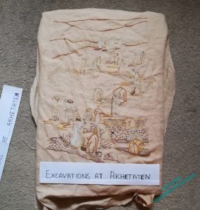 Unironed, unfinished View of the excavation, with a paper title laid over it.
