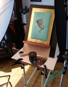 The head of Nefertiti, mounted on gold cloth, on set at the photographer's.