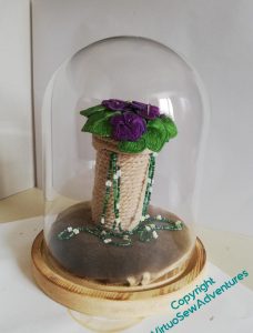 First assembly of the violets, the beads, and the pot. Not entirely successful..