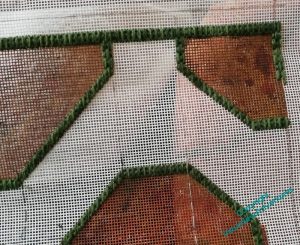 View of one corner of the canvas. All the borders are in the same stitch, and it all looks a bit samey and dull.