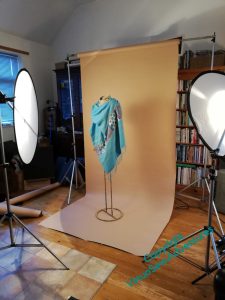 The Nefertiti Shawl swathes a metal mannequin, set in front of a sandy coloured background