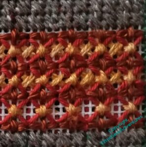 Tangled mess of cross stitches overlaying one another and not looking good.
