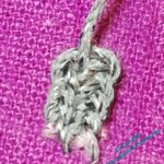 Close up of a small section of plaited braid stitch.