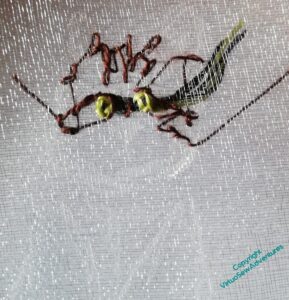 Close up of the beginning of the cat. It looks particularly confusing because you can see the back of the stitches through the gauze.
