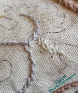 A false start - wheatear stitch. I decided in the end to use Palestrina Knot Stitch for all three leaves.