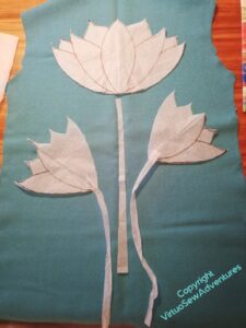 Paper cutouts laid on the back piece of the jacket.