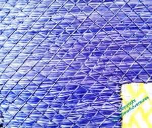 Particularly wonky bit of trellis couching, with lines radiating from the inner corner