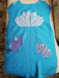 The pattern piece of the back of the coat, with the flowers in place