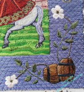 Barrels and roses in the lower right corner of Aethelflaed's border